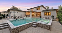a home with a swimming pool and patio