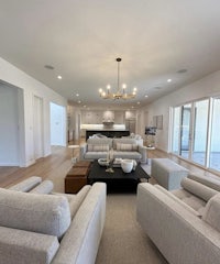 a large living room with couches and a coffee table