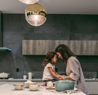 a mother and daughter in a kitchen